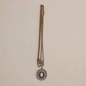 Necklace with keyhole and crystals. 11" in length. Necklace has two chains.